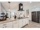 Open living area with kitchen island, stainless appliances, dining table and chairs at 1599 S Telluride St, Aurora, CO 80017