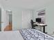 Cozy bedroom with closet space, comfortable bed, and a dedicated work area for added functionality at 3198 W Amherst Ave, Denver, CO 80236