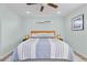 Cozy bedroom with a ceiling fan and bedside lamps at 3198 W Amherst Ave, Denver, CO 80236