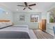 Bright bedroom with ceiling fan, natural light, and wood floors at 3198 W Amherst Ave, Denver, CO 80236