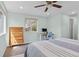 Inviting bedroom featuring hardwood floors and an abundance of natural light at 3198 W Amherst Ave, Denver, CO 80236
