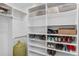 Well-organized closet with ample shelving for shoes and storage at 3198 W Amherst Ave, Denver, CO 80236
