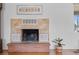 Close up of the fireplace with a brick hearth and decorative details at 3198 W Amherst Ave, Denver, CO 80236