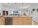 Open-concept kitchen with a large island, modern appliances, and seamless flow to the living spaces at 3198 W Amherst Ave, Denver, CO 80236
