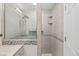 Luxurious shower with updated tile and built-in shelves at 3198 W Amherst Ave, Denver, CO 80236