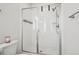 Modern bathroom features a glass-enclosed shower with white tile and sleek fixtures at 5388 Routt St # B, Arvada, CO 80002