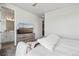 Serene bedroom boasts a cozy bed, television, and closet access at 5388 Routt St # B, Arvada, CO 80002