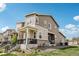 Two-story home with covered porch, neutral siding and manicured landscaping at 5388 Routt St # B, Arvada, CO 80002