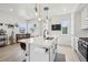 Kitchen island with seating with modern lighting and countertops at 5388 Routt St # B, Arvada, CO 80002