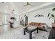 Living room area with open concept kitchen featuring bright natural lighting at 5388 Routt St # B, Arvada, CO 80002