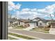 A neighborhood street shows well-maintained homes with landscaped yards, garages, and sidewalks at 5388 Routt St # B, Arvada, CO 80002