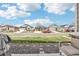 A street view of the neighborhood, showing multiple homes with manicured front lawns at 5388 Routt St # B, Arvada, CO 80002
