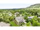 Aerial view of home with landscaped yard and mountain views in the distance at 6032 Umber St, Arvada, CO 80403