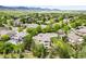 Panoramic aerial view of a residential area highlighting well-maintained homes and green spaces at 6032 Umber St, Arvada, CO 80403