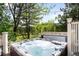 Deck with above ground hot tub and forested views at 6032 Umber St, Arvada, CO 80403