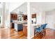 Spacious kitchen with a kitchen island, stainless steel appliances, and hardwood floors at 6032 Umber St, Arvada, CO 80403