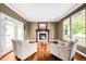 Cozy living room featuring a fireplace, hardwood floors, and comfortable seating at 6032 Umber St, Arvada, CO 80403