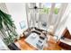 Overhead view showcasing the living room's high ceilings, large windows, and comfortable layout at 6032 Umber St, Arvada, CO 80403