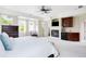 The main bedroom features a fireplace, mini bar, and plenty of natural light at 6032 Umber St, Arvada, CO 80403
