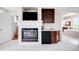 Close-up of main bedroom fireplace, mini bar, and cabinets at 6032 Umber St, Arvada, CO 80403