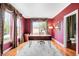 Home office boasts hardwood floors, natural light, and charming decor at 6032 Umber St, Arvada, CO 80403