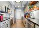 Modern kitchen featuring stainless steel appliances and sleek countertops, perfect for cooking at 7877 E Mississippi Ave # 1008, Denver, CO 80247