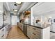 Beautiful updated kitchen with stainless steel appliances, open shelving, and breakfast bar at 7877 E Mississippi Ave # 1008, Denver, CO 80247