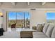 Cozy living room with a scenic view, comfortable seating and an adjacent sunroom for relaxation at 7877 E Mississippi Ave # 1008, Denver, CO 80247