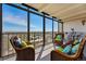 Sunroom with large windows offering panoramic views of the city and surrounding landscape at 7877 E Mississippi Ave # 1008, Denver, CO 80247