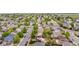Aerial view of the neighborhood showcasing the layout, trees, and proximity to other homes at 13664 Linden Ct, Thornton, CO 80602