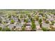 An aerial view shows a residential neighborhood with mature trees and varied home styles at 13664 Linden Ct, Thornton, CO 80602