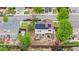 Aerial view of the backyard with solar panels, hot tub, fenced yard, patio, and landscaping at 13664 Linden Ct, Thornton, CO 80602
