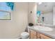 Light-filled bathroom featuring a shower-tub combination and a light-colored vanity at 13664 Linden Ct, Thornton, CO 80602