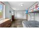 A bedroom featuring wood floors, two dressers, and a bunk bed with colorful bedding at 13664 Linden Ct, Thornton, CO 80602