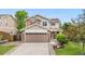 Two story home with stone accents, well-maintained lawn, landscaping, and a spacious two car garage at 13664 Linden Ct, Thornton, CO 80602