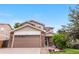 Charming two-story home with well-maintained lawn, stone accents, and a spacious two car garage at 13664 Linden Ct, Thornton, CO 80602