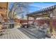 Outdoor living space featuring a covered patio area with seating and a grill at 3200 Eastman Ave, Boulder, CO 80305