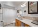 Bathroom with white vanity and ample lighting at 3200 Eastman Ave, Boulder, CO 80305