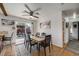 Bright dining room with a wooden table, ceiling fan, and sliding glass doors to an outdoor patio area at 3200 Eastman Ave, Boulder, CO 80305
