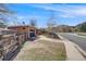 Front exterior of a brick home with a dark garage door and easy street access at 3200 Eastman Ave, Boulder, CO 80305