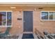 Welcoming entryway showcasing a secure front door with a charming exterior light and clear house number at 3200 Eastman Ave, Boulder, CO 80305