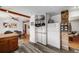 Kitchen with white refrigerator and unique wood features with view to dining room and open floor plan at 3200 Eastman Ave, Boulder, CO 80305