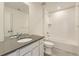 Bright bathroom featuring a white vanity with gray countertop and a clean, tiled shower-over-tub at 6719 Juniper Dr, Thornton, CO 80602
