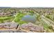 Community featuring townhomes, pond, golf course and green spaces, as seen from a bird's eye view at 3751 W 136Th Ave # F4, Broomfield, CO 80023