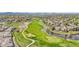 This scenic aerial shot shows the golf course and lush landscape of this community at 3751 W 136Th Ave # F4, Broomfield, CO 80023