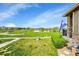 Backyard view overlooking golf course, pond, lush grass and professional landscaping from outdoor living space at 3751 W 136Th Ave # F4, Broomfield, CO 80023
