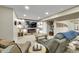 Finished basement with modern fireplace, large television, and plush seating at 3751 W 136Th Ave # F4, Broomfield, CO 80023