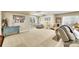 Basement with play area, comfortable seating, and neutral carpet at 3751 W 136Th Ave # F4, Broomfield, CO 80023
