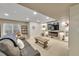 Entertainment room with a plush leather sofa, modern fireplace, and shelving at 3751 W 136Th Ave # F4, Broomfield, CO 80023