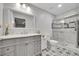 Elegant bathroom with gray vanity, patterned tile floor, and glass shower at 3751 W 136Th Ave # F4, Broomfield, CO 80023